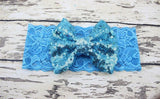 Childrens Big Sequined Bow with Lace Headband Hair AccessoryA cute girls Big Sequined Bow with Lace Headband Hair Accessory.
This elasticated sequined headband is a great way of dressing up and glamorising any outfit.These arlavishhairandbeauty.comChildrens Big Sequined Bow