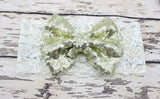 Childrens Big Sequined Bow with Lace Headband Hair AccessoryA cute girls Big Sequined Bow with Lace Headband Hair Accessory.
This elasticated sequined headband is a great way of dressing up and glamorising any outfit.These arlavishhairandbeauty.comChildrens Big Sequined Bow
